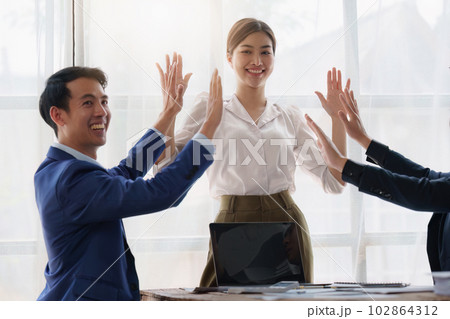 Group of Business People Meeting and Corporate partnership and achievement concept. Business people celebrate when successful work project 102864312