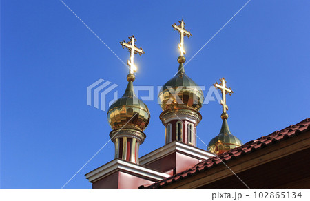 Three Orthodox crosses against the background of a blue summer sky 102865134