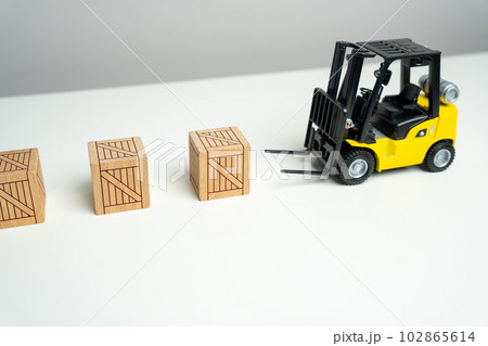 Wooden crates are picked up by a forklift. Preparation of order for shipment. Efficient process of preparing orders for shipment. It signifies the importance of proper packaging and logistics Wooden crates are picked up by a forklift. Preparation of order for shipment. Efficient process of preparing orders for shipment. It signifies the importance of proper packaging and logistics 102865614