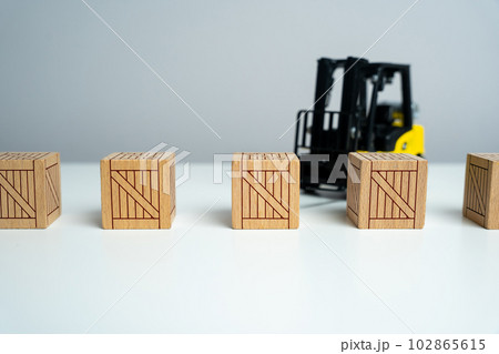 Wooden crates and forklift. Production and freight of goods. Transport department. Effective logistics and supply chain management in delivery of goods. Importance of proper packaging Wooden crates and forklift. Production and freight of goods. Transport department. Effective logistics and supply chain management in delivery of goods. Importance of proper packaging 102865615