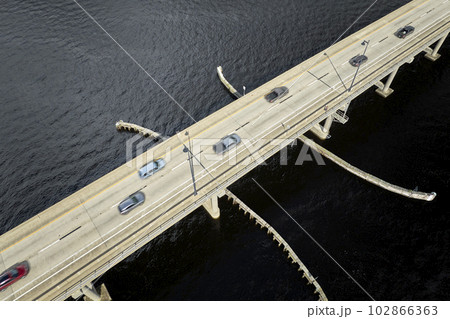 Barron Collier Bridge and Gilchrist Bridge in Florida with moving traffic. Transportation infrastructure in Charlotte County connecting Punta Gorda and Port Charlotte over Peace River Barron Collier Bridge and Gilchrist Bridge in Florida with moving traffic. Transportation infrastructure in Charlotte County connecting Punta Gorda and Port Charlotte over Peace River 102866363