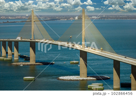 Aerial view of Sunshine Skyway Bridge over Tampa Bay in Florida with moving traffic. Concept of transportation infrastructure 102866456