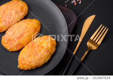Delicious steam cutlets with carrots, cheese, salt and spices 102867029