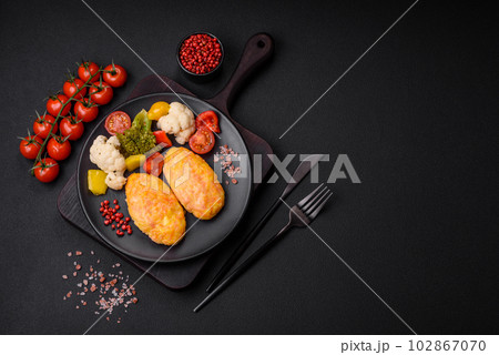 Delicious steam cutlets with carrots, cheese, salt and spices 102867070