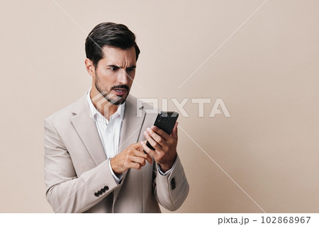 smartphone man entrepreneur business smile happy portrait suit hold call phone 102868967