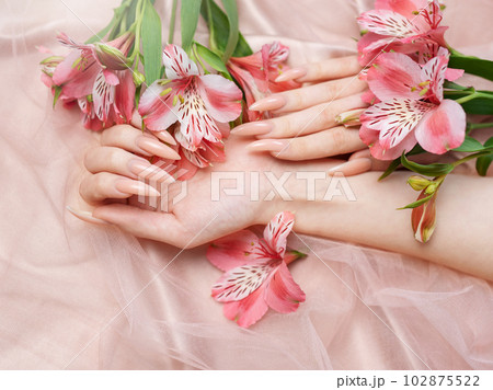 Elegant pastel pink natural manicure. Elegant pastel pink natural manicure. 102875522