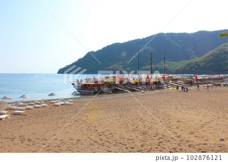Yacht on the shore of the cozy bay of Adrasan, near Antalya and Kemer, Turkey Yacht on the shore of the cozy bay of Adrasan, near Antalya and Kemer, Turkey 102876121