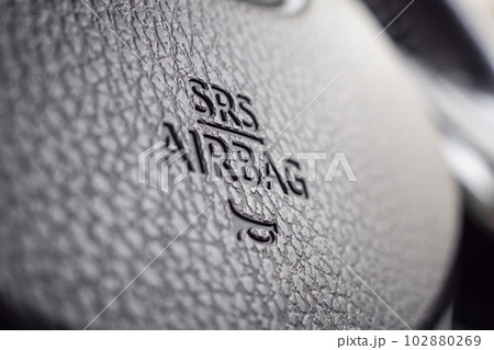 Safety airbag sign on car steering wheel with horn icon 102880269