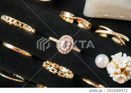 Gold jewelry diamond rings show in luxury retail store display showcase Gold jewelry diamond rings show in luxury retail store display showcase 102880472