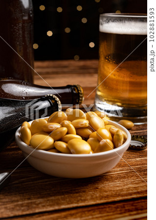 salted Lupin Beans with beer on bar table salted Lupin Beans with beer on bar table 102881593