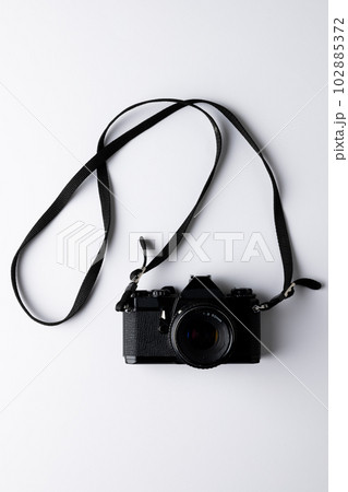 Close up of black camera with laces on white background with copy space 102885372