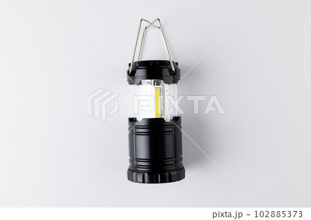 Close up of black camping lamp on white background with copy space 102885373