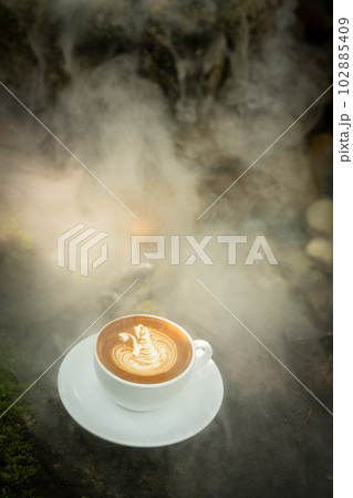 Background Coffee cup and beans on old kitchen table.  102885409