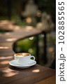 Background Coffee cup and beans on old kitchen table.  102885565