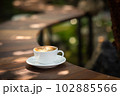 Background Coffee cup and beans on old kitchen table.  102885566