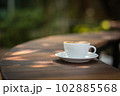 Background Coffee cup and beans on old kitchen table.  102885568