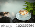 Background Coffee cup and beans on old kitchen table.  102885569