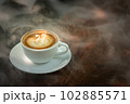 Background Coffee cup and beans on old kitchen table.  102885571