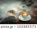 Background Coffee cup and beans on old kitchen table.  102885573