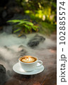 Background Coffee cup and beans on old kitchen table.  102885574