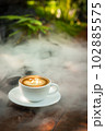 Background Coffee cup and beans on old kitchen table.  102885575