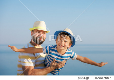 Happy family having fun on summer vacation Happy family having fun on summer vacation 102887007