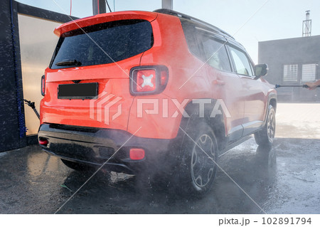Car wash with high pressure water. Professional cleaning and car cleaning 102891794