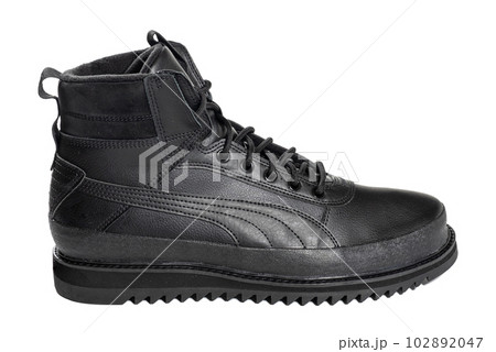Black boot isolated on white background, close up. Footwear Concept. Black boot isolated on white background, close up. Footwear Concept. 102892047