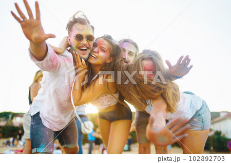 Teenagers Friends have fun at the holi festival. Beach Party. Celebrating traditional indian spring holiday. 102892703