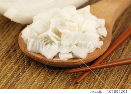 Sliced coconut with chopstick 102895201