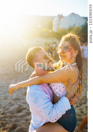Beautiful couple enjoy each other on Holi festival Friendship, Leisure, Vacation, Togetherness. Beautiful couple enjoy each other on Holi festival Friendship, Leisure, Vacation, Togetherness. 102896839