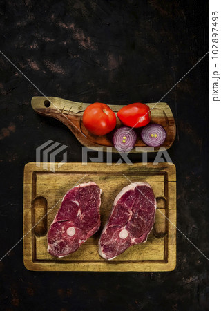 Patagonian lamb meat presented on the wooden table, Patagonia Argentina. 102897493