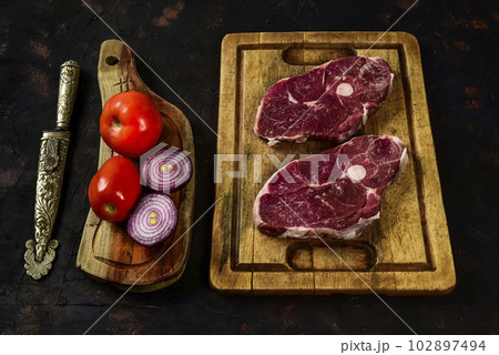 Patagonian lamb meat presented on the wooden table, Patagonia Argentina. 102897494