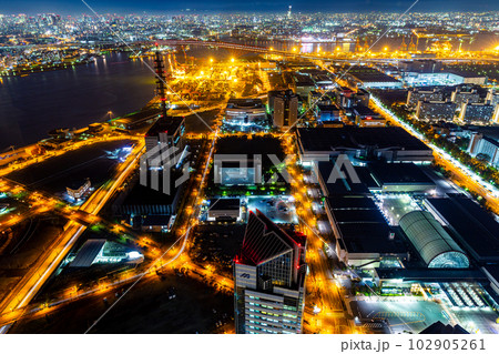 Aerial view of Kobe city with bright light on roads at night. Aerial view of Kobe city with bright light on roads at night. 102905261