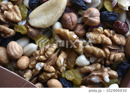 Assorted nuts in a box close-up. Delicious different nuts in a box. Assorted nuts in a box close-up. Delicious different nuts in a box. 102906830