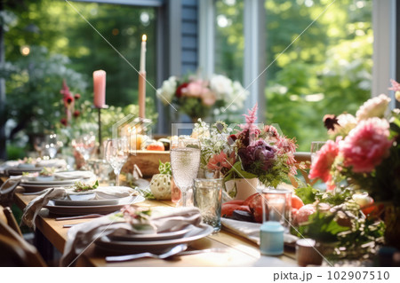 Romantic table setting with candles and flowers Romantic table setting with candles and flowers 102907510
