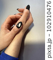 fashion manicure of nails on a beautiful background 102910476