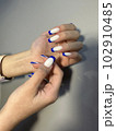 Amazing natural nails. Women's hands with clean manicure 102910485