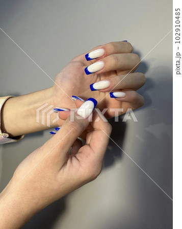 Amazing natural nails. Women's hands with clean manicure Amazing natural nails. Women's hands with clean manicure 102910485