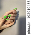 Amazing natural nails. Women's hands with clean manicure 102910486