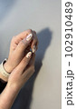 Closeup photo of a beautiful female hands 102910489