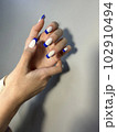 Closeup photo of a beautiful female hands 102910494