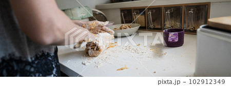 Woman kneading gnocchi dough Woman kneading gnocchi dough 102912349