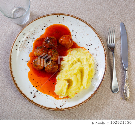 Meatballs in sauce served with mashed potatoes Meatballs in sauce served with mashed potatoes 102921550