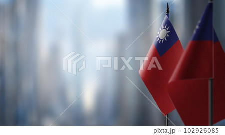 Small flags of the Taiwan on an abstract blurry background 102926085