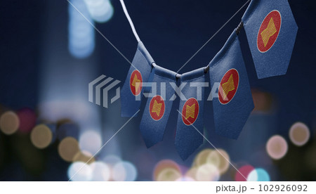 A garland of ASEAN national flags on an abstract blurred background 102926092