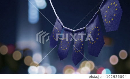 A garland of European Union national flags on an abstract blurred background A garland of European Union national flags on an abstract blurred background 102926094