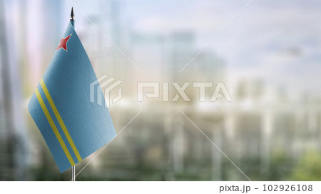Small flags of the Aruba on an abstract blurry background Small flags of the Aruba on an abstract blurry background 102926108