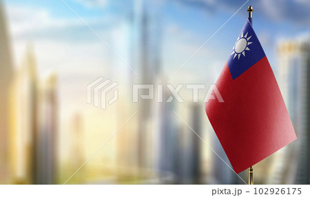 Small flags of the Taiwan on an abstract blurry background 102926175