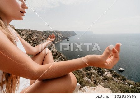 Woman sea pilates. Sporty middle-aged woman training in pilates on yoga mat by sea. concepts of health, wellness, and mindfulness in exercise, promoting the benefits of active and balanced lifestyle Woman sea pilates. Sporty middle-aged woman training in pilates on yoga mat by sea. concepts of health, wellness, and mindfulness in exercise, promoting the benefits of active and balanced lifestyle 102930868
